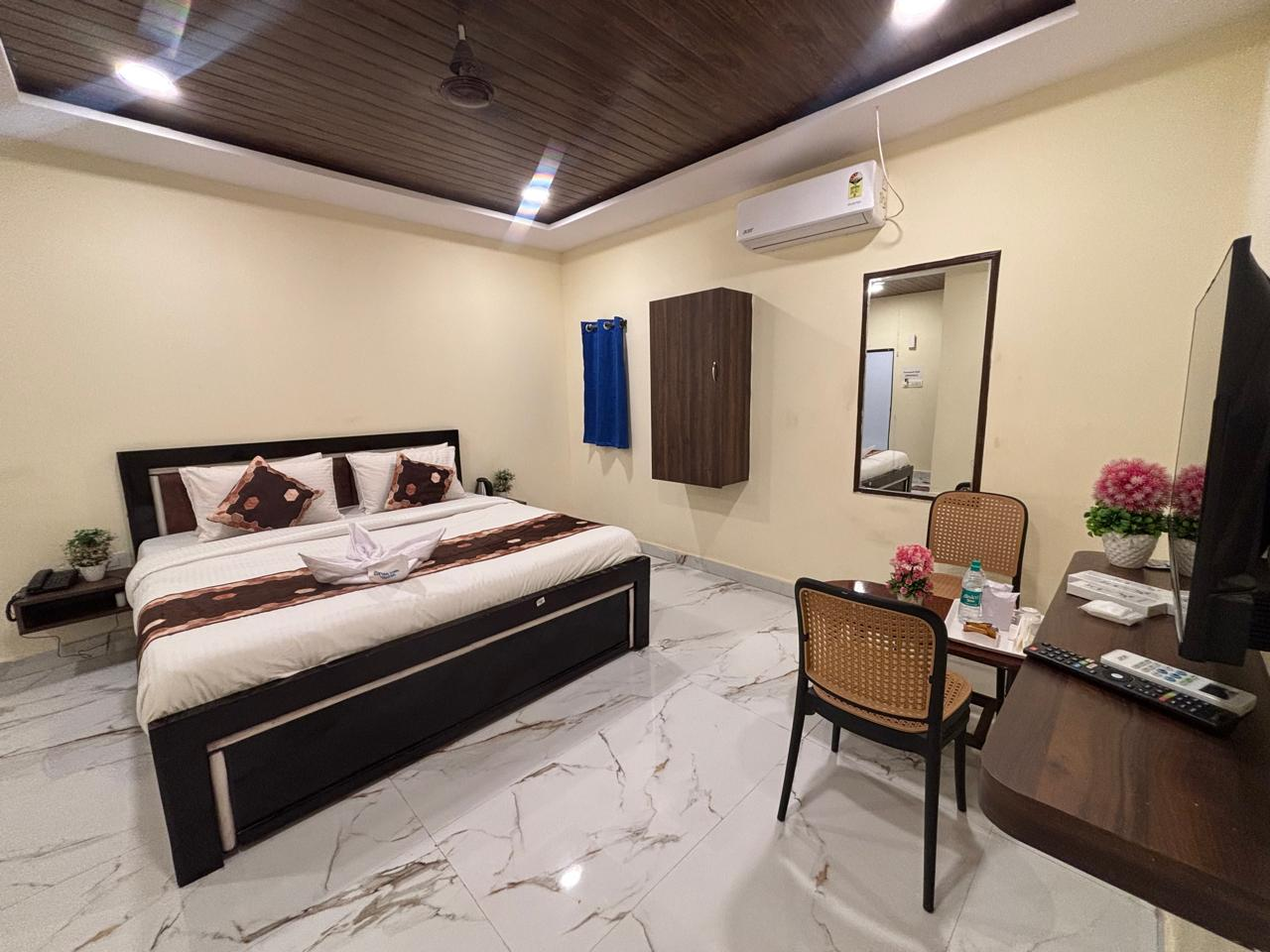 Deluxe AC Room with king-size bed and dressing area